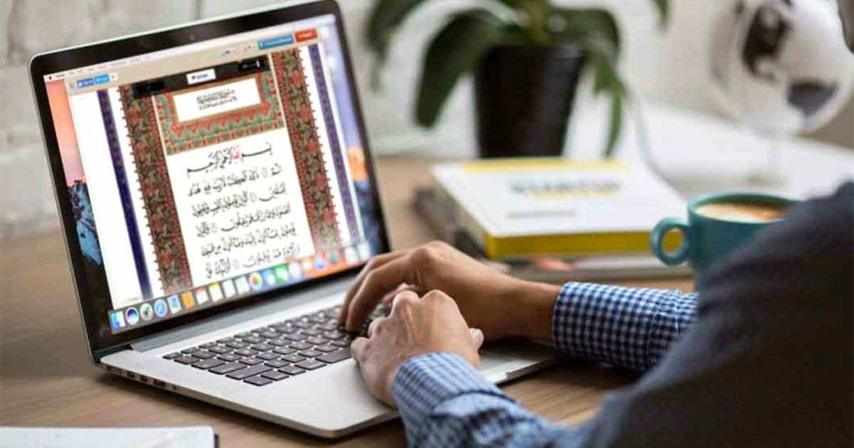 Quran visible on a laptop screen during an online class